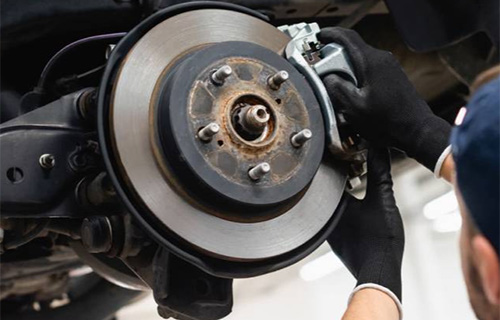 An exposed car brake being repaired at a shop for auto repair in Safety Harbor for auto services