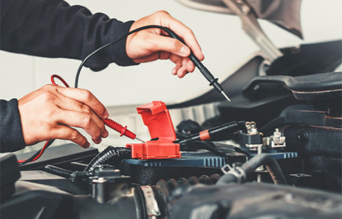 A car battery being tested at a shop for auto repair in Safety Harbor that also specialized in electrical repair in Safety Harbor