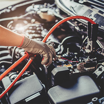 Hands testing electronics in electrical repair in Safety Harbor